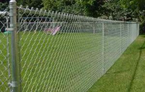 chain link fence across grassy area